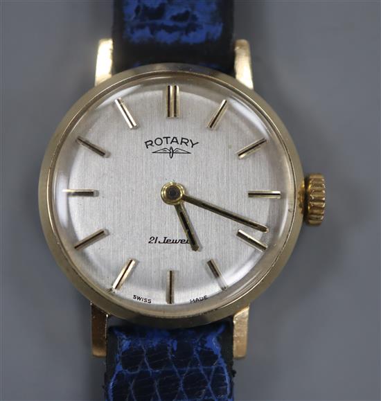 A ladys 9ct gold Rotary manual wind wrist watch, on associated blue leather strap.